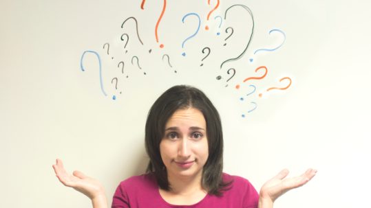 Woman with question marks over head