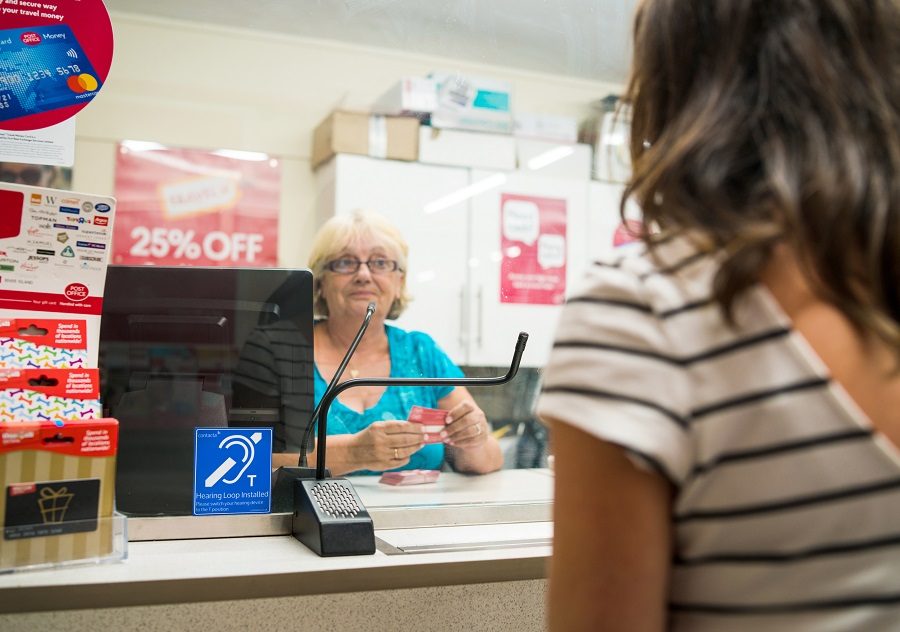 Woman being served at Post Office