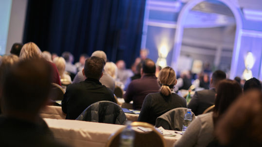 large group of people at a conference